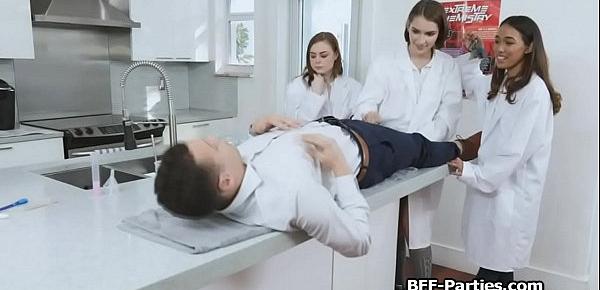 Three girlfriends sharing cock in lab coat